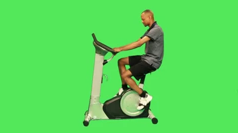 Male training on exercise bicycle Stock Footage 12159012