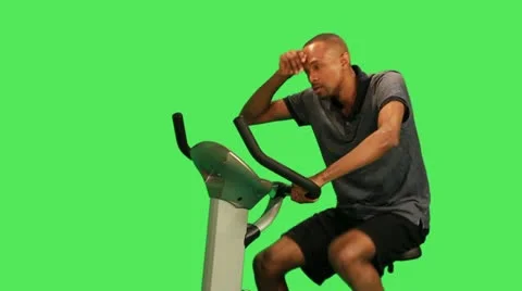 Male training on exercise bicycle Stock Footage 12159013