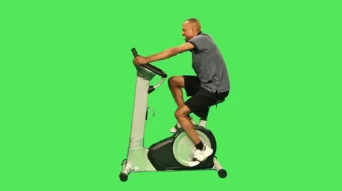 Male training on exercise bicycle Stock Footage 12159032