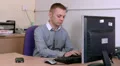 Male typing on computer HD Footage