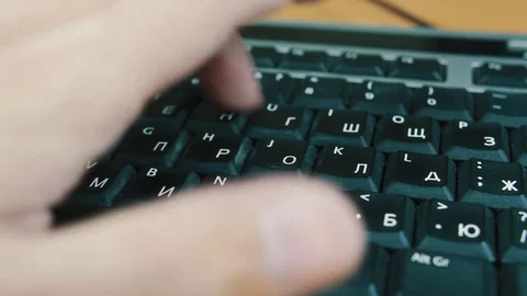 Male typing on the computer keyboard with one hand. Close-up. Stock Footage 70567522
