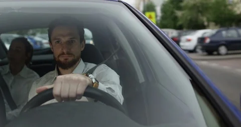 Male uber driver talks to his passenger inside the car Stock Footage 109560415