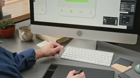 Male UI Developer Drawing Wireframe Mockups with Graphic Tablet Stock Footage 327900122