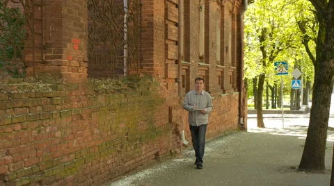 Male use tablet PC to find way in city Stock Footage 63145860