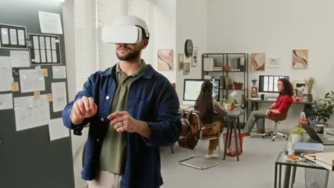 Male User Interface Designer with AR Headset Developing Wireframes Video stock 327905525
