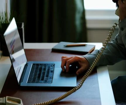 Male Using Business Analytics Dashboard on Laptop Stock Photos