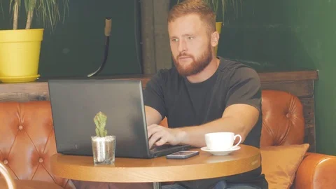 Male using laptop in cafe Stock Footage 95217705