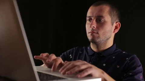 Male using laptop notebook isolated black background Stock Footage 82919849