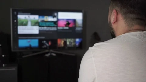 Male using smart big TV at home Stock Footage 126111396