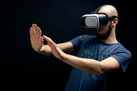 Male using VR gear is dodging with both hands Stock Photos