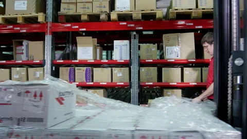 Male warehouse workers take and transport goods on forklift Stock Footage 238468689