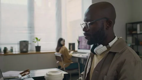 Male Web Developer Drinking Coffee Creating Software Program in Office Stock Footage 299246699