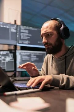 Male web developer writing code and listening to music 写真素材