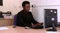 Male at work is interupted by his mobile HD Footage