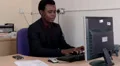 Male at work is interupted by a phone call HD Footage