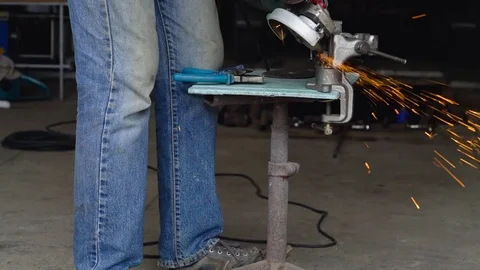 Male worker with angular grinding machine is cutting the metal. Slow motion Vídeos de archivo 78424004