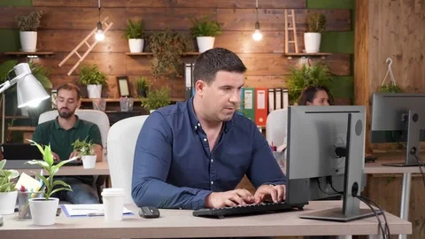 Male worker asks for help from his female colleague Stock Footage 112653468