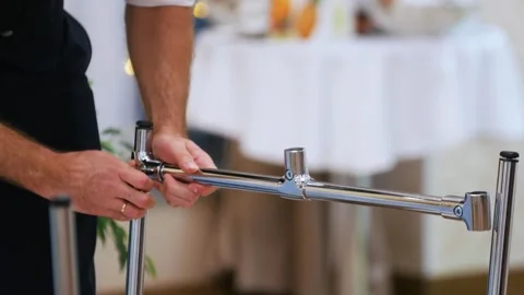 Male worker assembling chrome metal furniture structure Stock-Footage 326209946