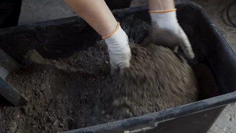 Male Worker Builder Guest Worker Mixes Cement Mortar Video stock 129340265