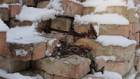 Male worker, builder taking bricks out of the row. Stock Footage 75348390