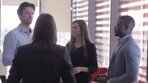 Male worker explaining his minds with other colleagues Stock Footage 73874887