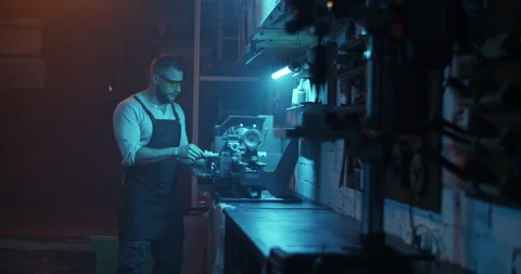 Male worker in eyewear using lathe machine Stock Footage 259393569