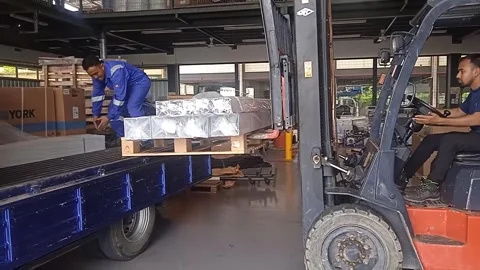 Male Worker Loading Material with Forklift and a Helper Stock Footage 305771461