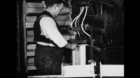 Male Worker At Machine Driving Nails Into Toy Piano Frames Stock Footage 114763877