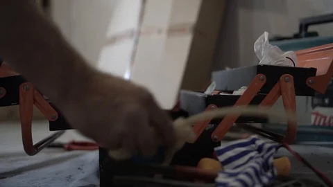 Male worker pulls things out of the tool box Stock Footage 107723800