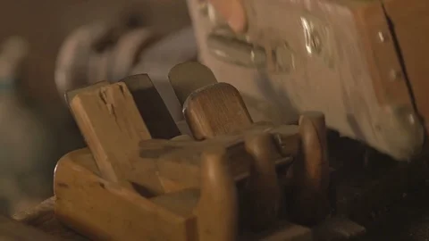 Male worker puts things in order in his workshop after work , 4K Stock Footage 69732566