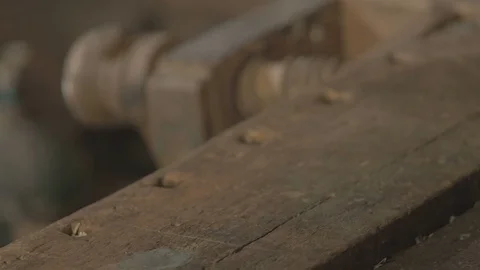 Male worker puts things in order in his workshop after work , 4K Stock Footage 69735197