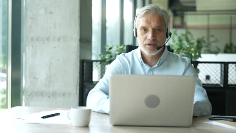 Male worker talking with headset, helping and consulting Stock Footage 295186275