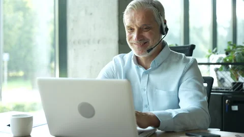 Male worker talking with headset, helping and consulting Stock Footage 295186717