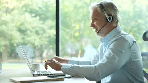 Male worker talking with headset, helping and consulting Stock Footage 295186734