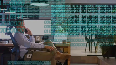 Male worker talking on phone in tech, binary streaming across desk, checking Stock Footage 334703234