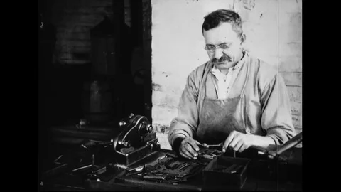Male Worker Tuning And Assembling Tone Producing Pieces Of Metal Stock Footage 114764173