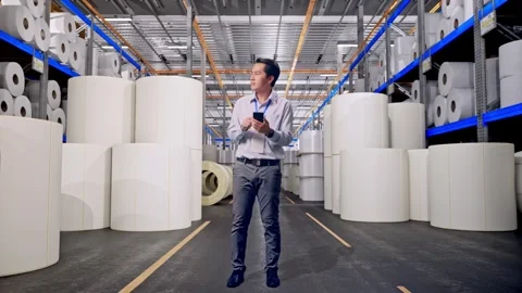 Male Worker Use Smartphone And Looking Around at Polymer Plant Stock Footage 334523129