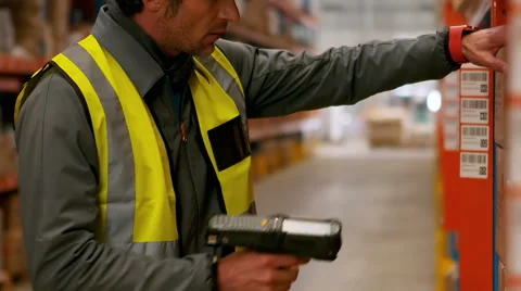 Male worker using barcode scanner | Stock Video | Pond5