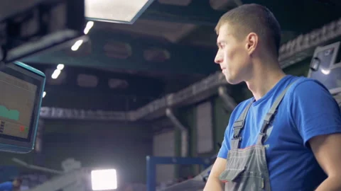 Male worker using digital computer touchscreen at a factory production line. Stock Footage 88805685