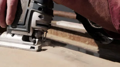 Male Worker Using Jigsaw to Cut Shape out of Wooden Template CLOSE UP Stock Footage 220940069
