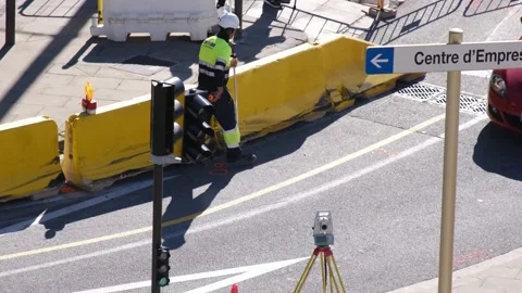 Male worker using a total station for road measurement Stock Footage 172542973