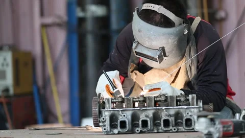 Male worker welding argon. Welding with argon or electrode, using a welding.. Stock Footage 336942497