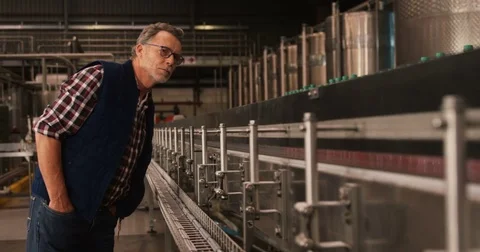 Male worker working at bottling plant Stock Footage