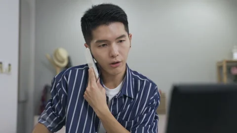 Male working from home coping with client demand Stock Footage 159437545