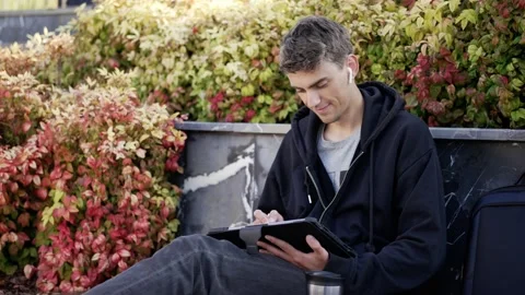 Male Working Outdoor with Tablet Computer Vídeo Stock 228857009