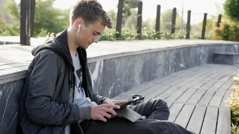 Male Working Outdoor with Tablet Computer Stock Footage 228857267