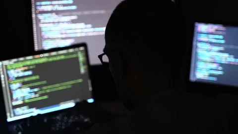 Male writing coding on three screens. Software programmer and web developer Stock Footage 222816676