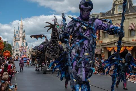 Maleficient dragon and characters in Disney Festival of Fantasy Parade Stock Photos