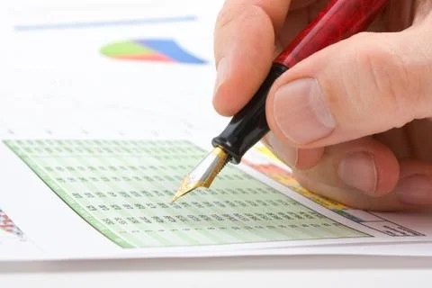 Males hand writing in the document Foto stock