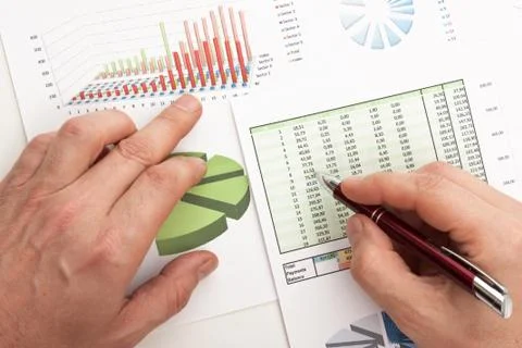 Males hand writing in the document Stock Photos